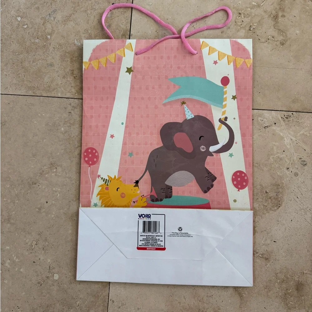 pink baby shower gift bag with circus scene